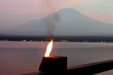 <p>Small torches were lit along the edge of the Lake &nbsp;</p>