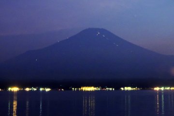 <p>As darkness fell, the lights of climber's huts began to glow on the upper slops of Mount Fuji</p>
