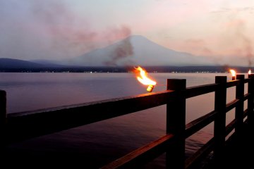 Small torches were lit all along the lakeside