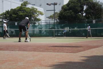 <p>People play tennis on one of the many tennis courts in the park.&nbsp;</p>