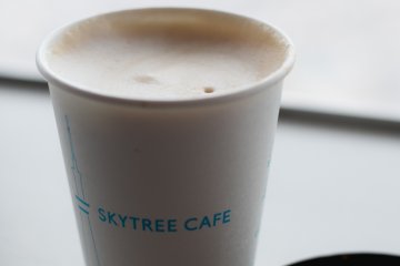 <p>Skytree caf&eacute; cappucino overlooking Tokyo</p>