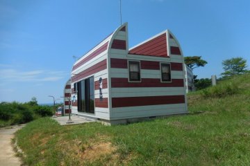Cat-shaped buildings decorate part of the island. You can even stay here overnight with reservations