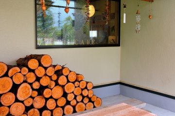 <p>Wood stacked outside the cafe</p>