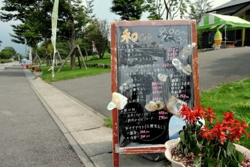 <p>Everything looks delicious on this cafe sign</p>