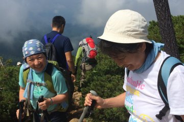 <p>Hikers make a descent after a rest on top of Mt. Shibutsu.</p>