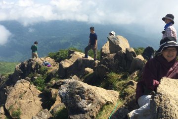 <p>Hikers enjoy a break at the top of Mt. Shibustu at about 9:15 a.m.</p>