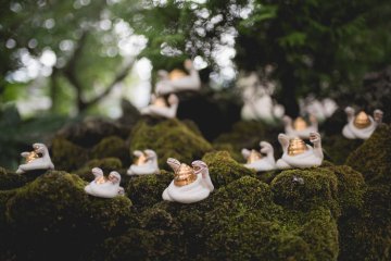 <p>Figurines near the purified water basin</p>