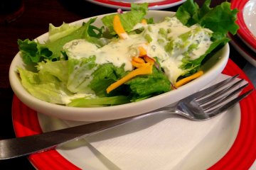 <p>TGI Friday's salad topped with a refreshing dressing surely is appetizing!</p>
