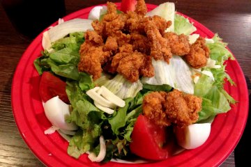 <p>Crispy fried chicken on veggies made a wonderful complement to the other dishes served.</p>
