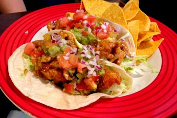 <p>These tacos are gigantic and super delicious! Plus, the chips are cheesy and crunchy.</p>