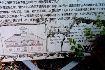 Weathered sign offers information about one of the school houses