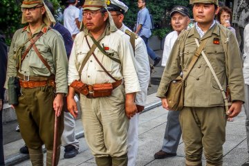 <p>Despite being one of the hottest days of the year these people were dressed in full military attire</p>