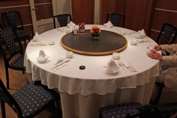<p>The table in our private dining room. The lazy Susan turntable is fun and convenient &nbsp;</p>