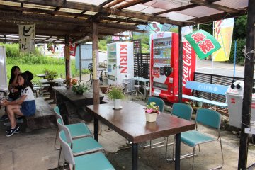 <p>The dining area under the patio awning</p>