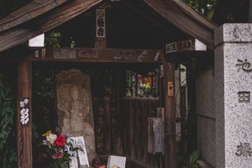 <p>By the road entrance</p>