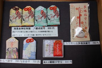 <p>Omamori protective charms with Tengu and Okame on them</p>