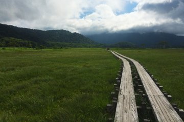 <p>The fog at Oze clears to reveal mountains.</p>