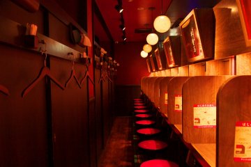 <p>Counter seating separated into booths.</p>