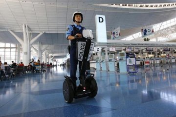 <p>Japan officer patrolling Haneda Airport</p>