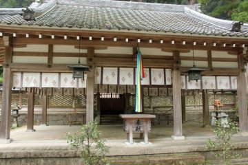 <p>The donation box, bell pull and gate to the main shrine in the background</p>