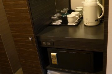 The pantry is located next to the wardrobe with a sliding door and mirror.