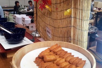 <p>A fall display behind the inarizushi (fried tofu skin stuffed with vinegar rice)</p>