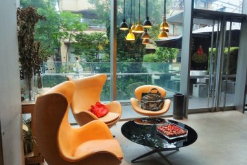 <p>Comfortable chairs look out onto the veranda</p>