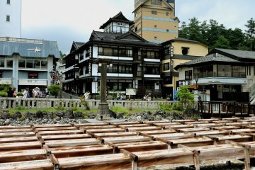 <p>The water is directed through a series of wooden chutes to reduce the temperature</p>