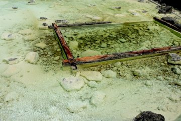 <p>Pale yellow sulfur deposits. Sulfur is what gives hot spring water that 'rotten egg' smell.</p>