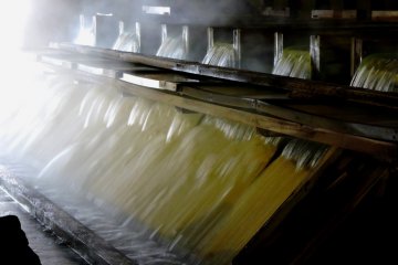 <p>A row of wooden chutes designed to cool the extremely hot water</p>
