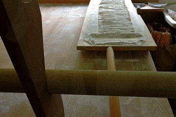 <p>Hand cut noodles resting on a board &nbsp;</p>