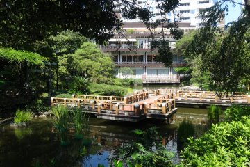 <p>An event hall and cafe stands at the garden's edge</p>