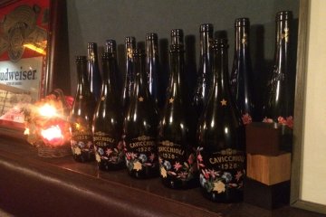 <p>Old bottles lined up for display.</p>