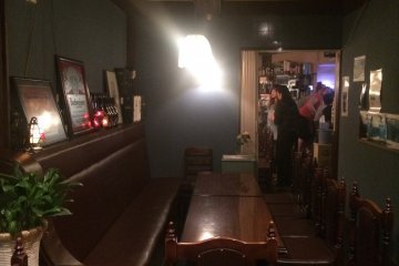 <p>Two of the four tables in the back room that can seat 11 customers.</p>