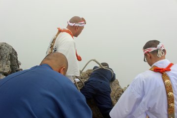 <p>A disciple being dangled over the Nishi no Nozoki in the second Test of Courage</p>