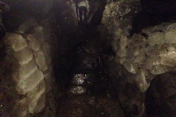 <p>Inside the ice cave: ice resembling crystal formations surrounding all walls</p>