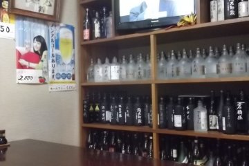 <p>The decor consists largely of bottles...</p>