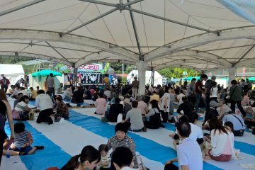 Some people enjoying the festival under the canape