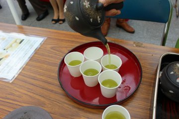 <p>Pouring the perfect cup of Yamato green tea</p>
