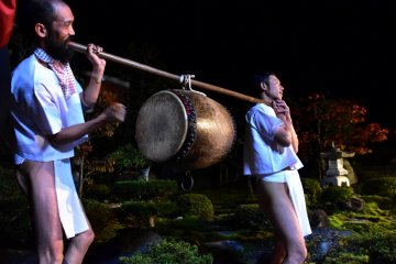 <p>Drummers enjoying the sight in a garden</p>