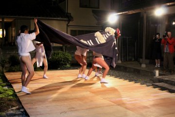 <p>Lion Dance performed on a temporary stage set in a garden of a newly-built house</p>