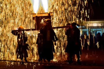 Even mikoshi (portable shrines) are configured with fireworks that cascade down.