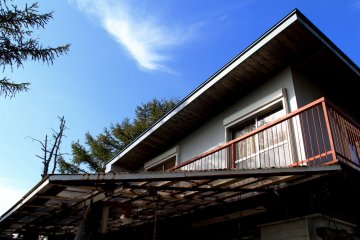 <p>Two rooms viewed from the outside looking towards Mount Fuji</p>