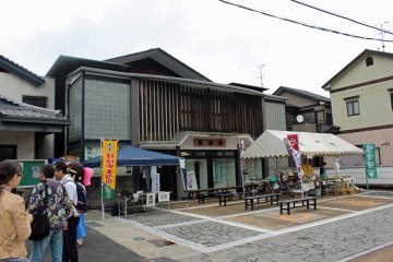 <p>The Sumo Museum and tourist information center/rest area. The white tent is a food booth selling chanko soup (a hearty soup, filled with chicken, sausage and vegetables, eaten by sumo wrestlers to achieve their large size). It also had yaki-dango, konyaku and locally made omiyage</p>