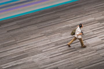 Busy photographer admiring Diamond Princess in Yokohama