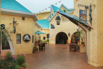 <p>Before the shops open, there are only a few people walking through the 'shopping village'</p>