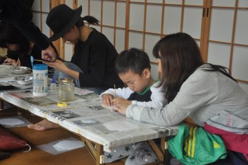 <p>People can try the various steps of making a Buddhist altar</p>