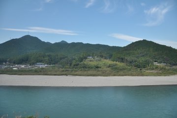 Tiny villages are scattered on hills along the river