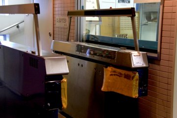 <p>An automatic ticket gate with an actual peek inside</p>