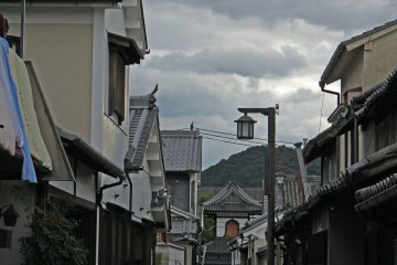 <p>The tower of a Meiji-era temple at the end of a narrow street &nbsp;</p>